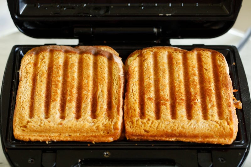 grilled vegetable sandwiches inside the panini press.