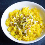 meethe chawal in a white bowl.