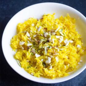 meethe chawal in a white bowl.