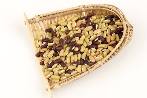 rice beans on a a bamboo sifter.