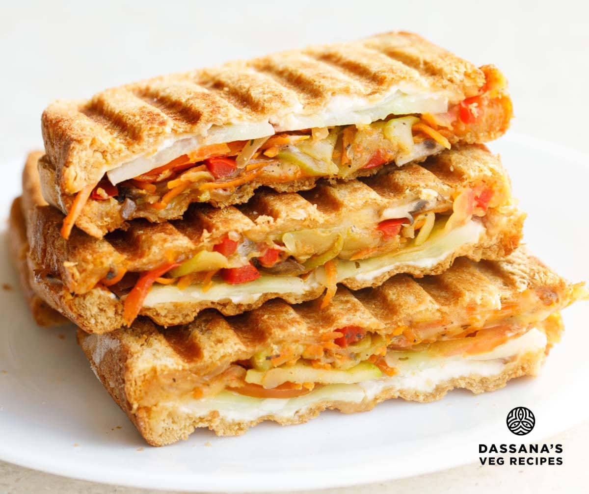 vegetable sandwich stacked on top of each with visible veggie and cheese layers.