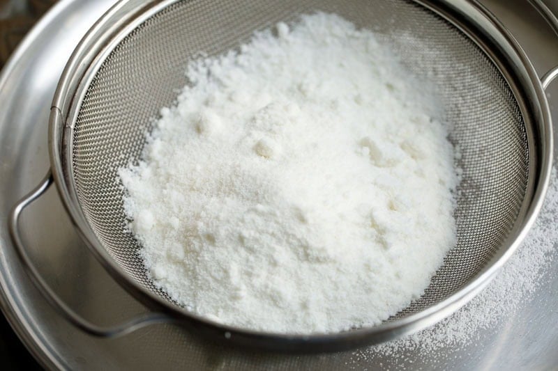 powdered sugar in a sieve.