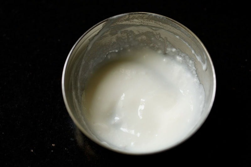 Whisked curd in a bowl.