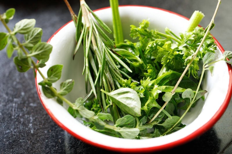 Fresh herbs in a bowl.