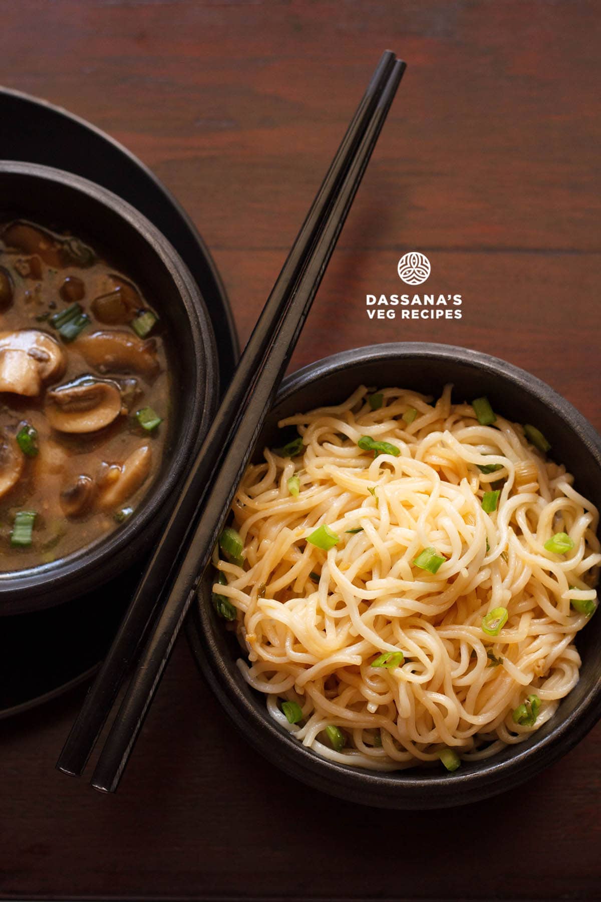 Chilli garlic noodles served in a black wooden bowl.