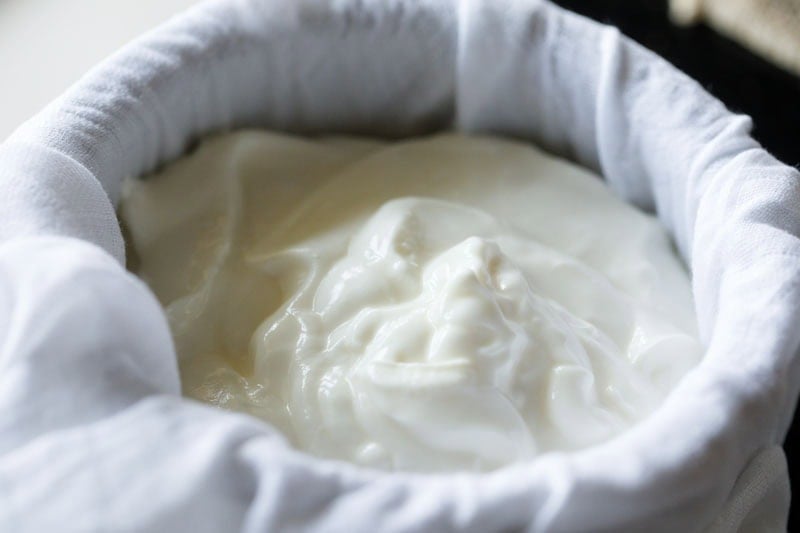 Freshly made yogurt in a cheese cloth.
