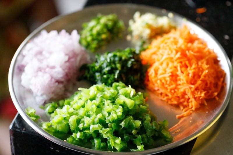 Chopped vegetables on a silver plate.