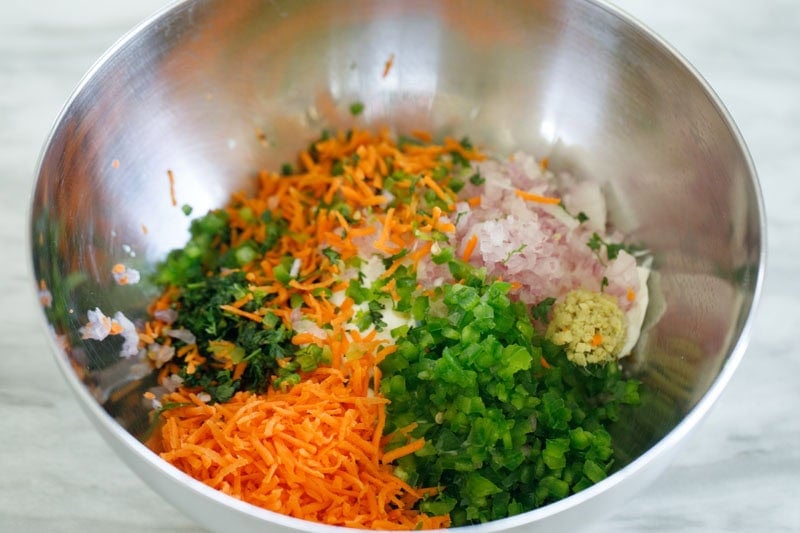 Colorful chopped vegetables in bowl.