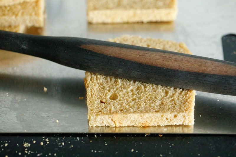 Sliced bread with a rolling pin on it.