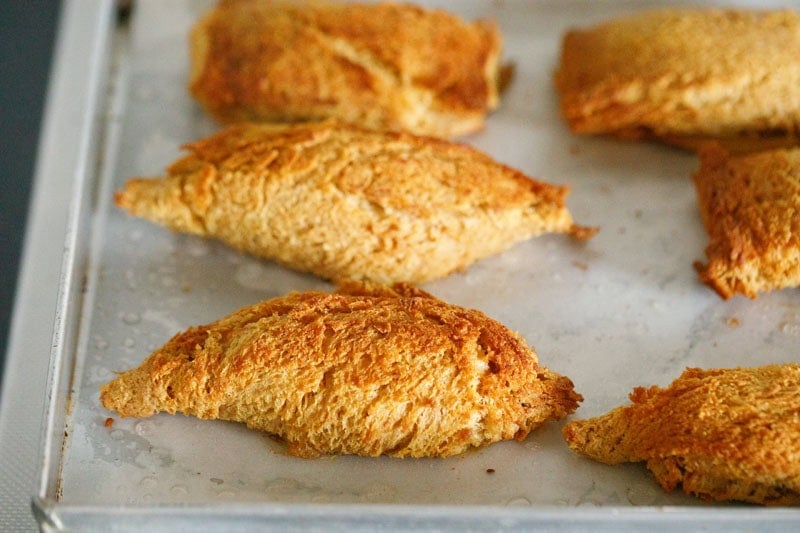 Golden brown baked dahi ke sholey on baking tray.