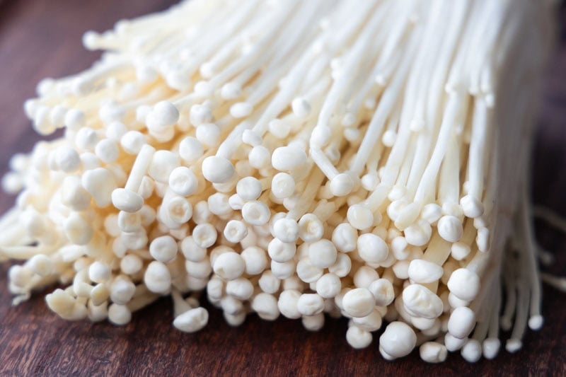 Closeup shot of enoki mushrooms.