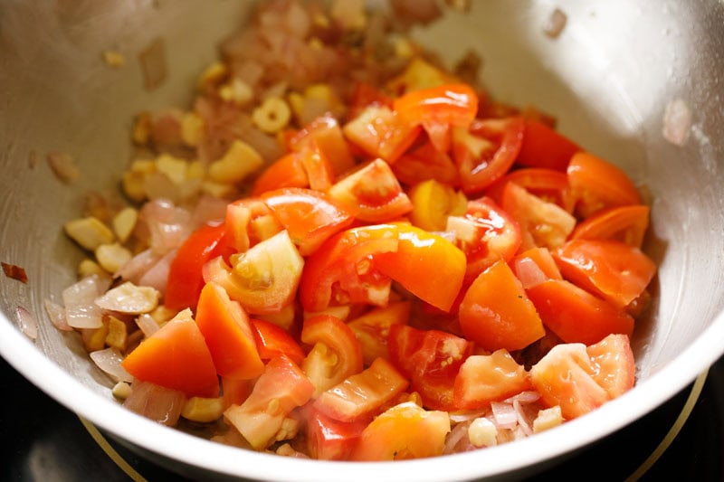 Chopped tomatoes in skillet.