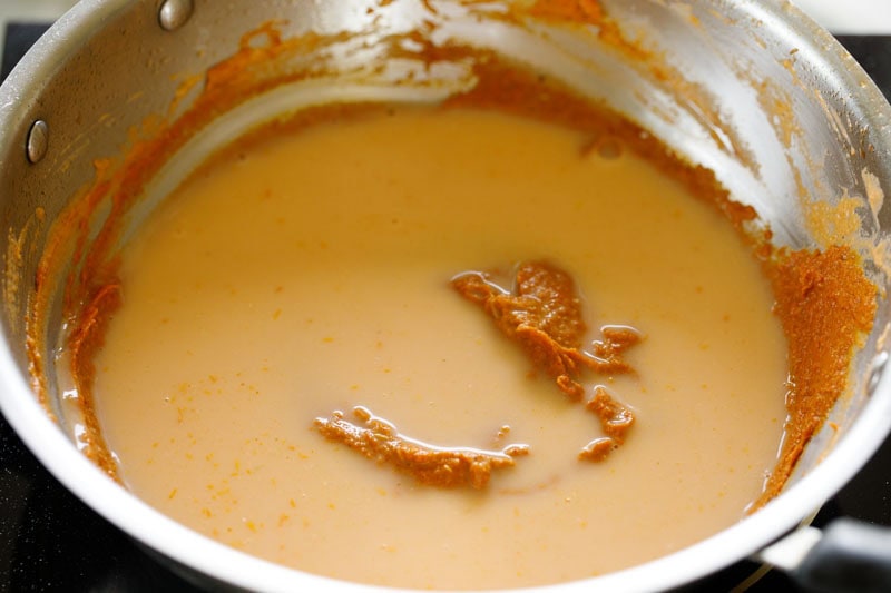 Water in the pan with the masala paste.