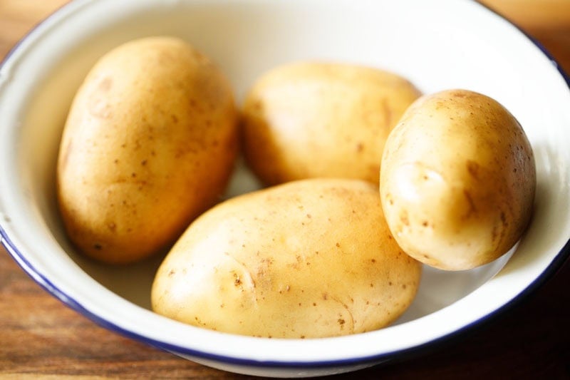 Potatoes in a white bowl.