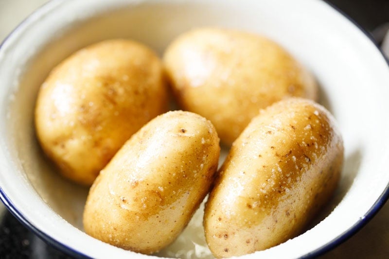 Oil and salt rubbed on the potatoes.