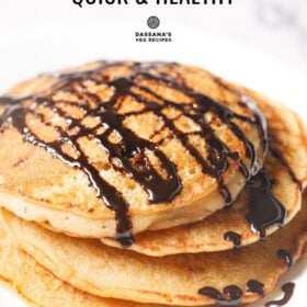 Stack of buttermilk pancakes with chocolate sauce.