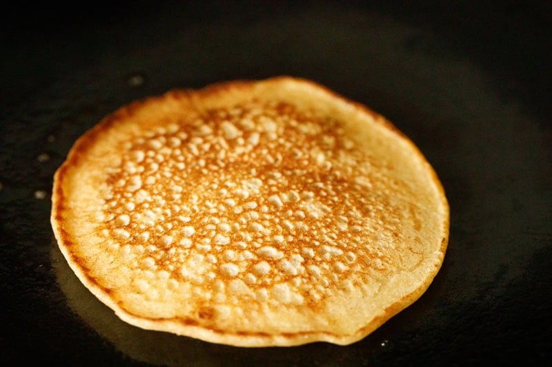 Golden brown buttermilk pancake on skillet.
