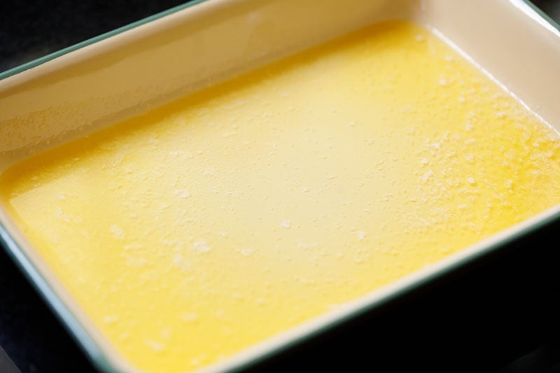 Melted butter in baking dish.