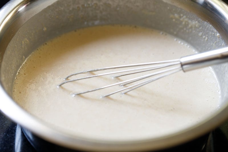 Whisking batter in bowl.