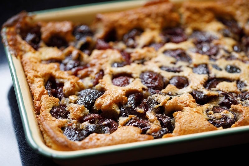 Baked cherry cobbler in dish.