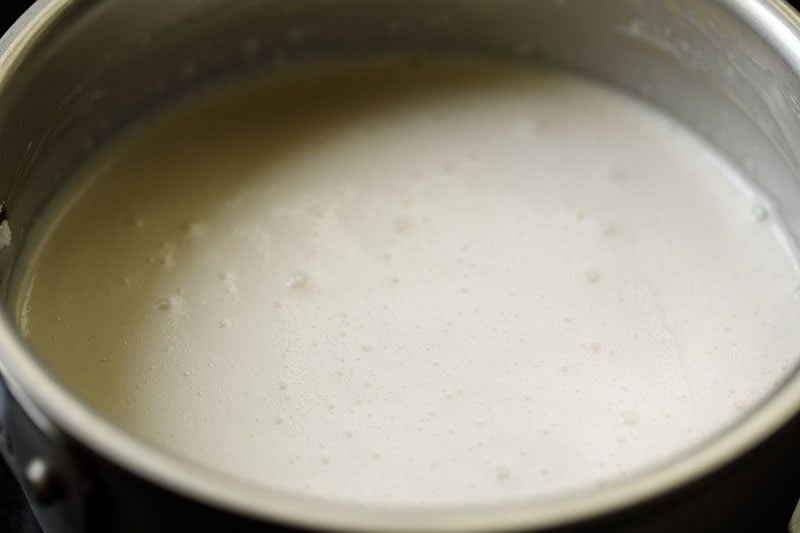 Custard being cooked on stovetop and thickened.