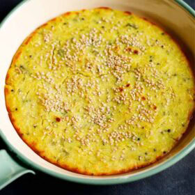 Savory Gujarati handvo in a pan.