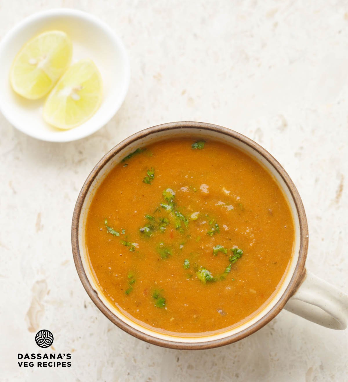 Bowl of lentil soup with cilantro garnish.