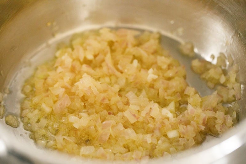 Sautéed onions in a pot.