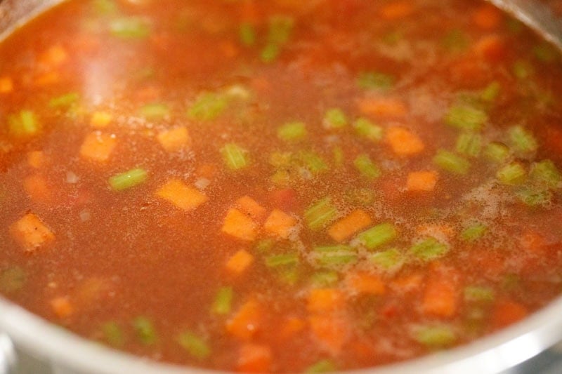 Lentil soup mixture in a pot.