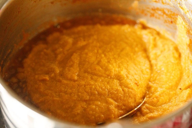 Thick, pureed lentil soup in pot.