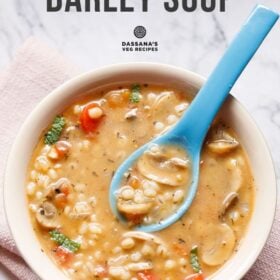 Mushroom barley soup in a bowl with blue spoon with text layovers.
