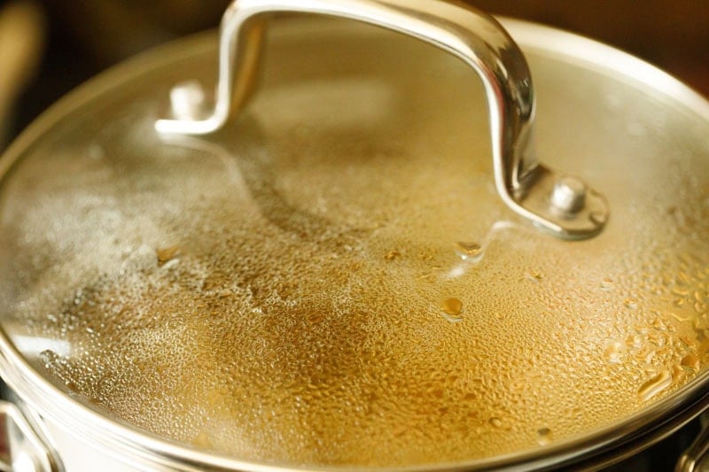 Pan covered with glass lid.