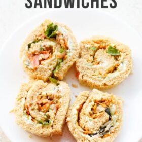 Pinwheel sandwiches on white plate with text layovers.