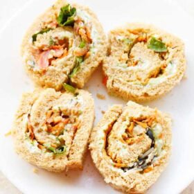 Pinwheel sandwich on white plate.