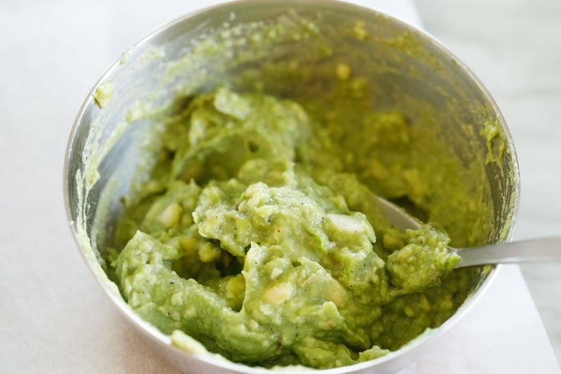 Avocado filling in bowl.
