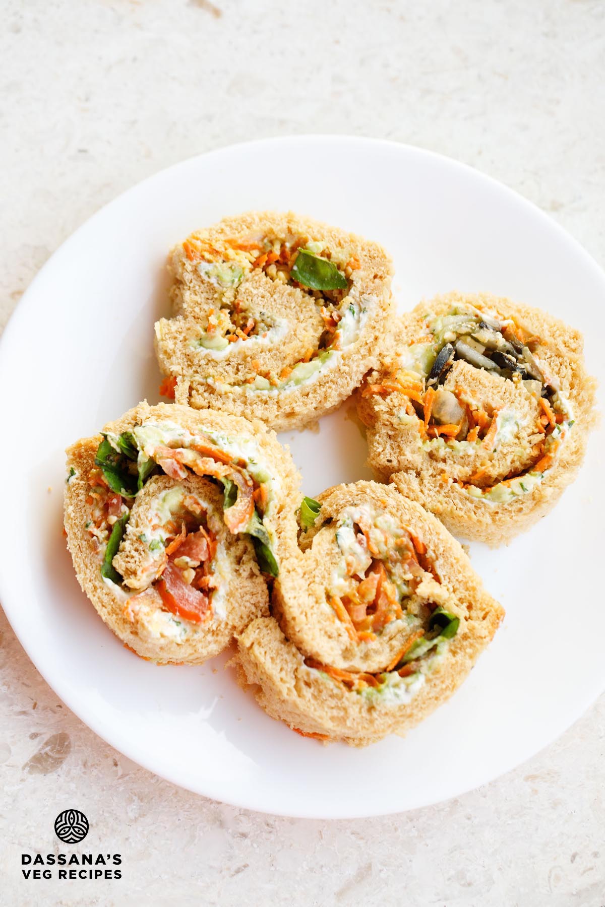 Pinwheel sandwiches on a plate.