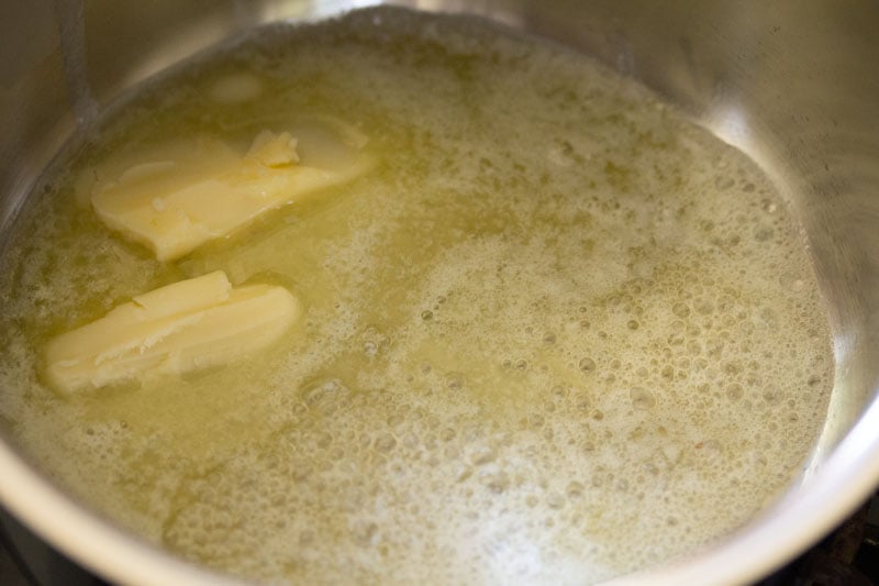 Melted butter in bubbling saucepan.