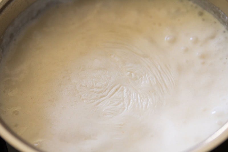 Simmering creamy liquid in pot