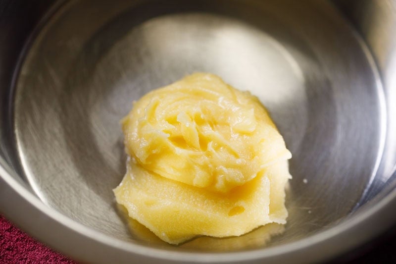ghee added in a bowl for making badusha.
