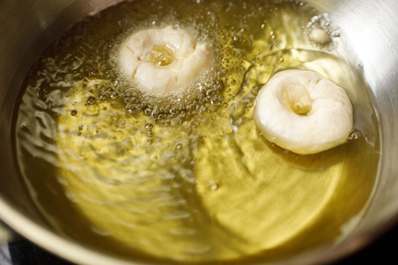 shaped badusha in hot oil.