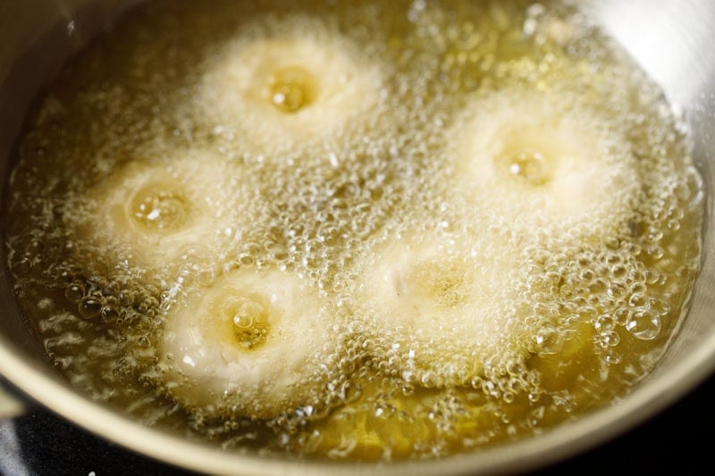 frying badusha sweet in hot oil.