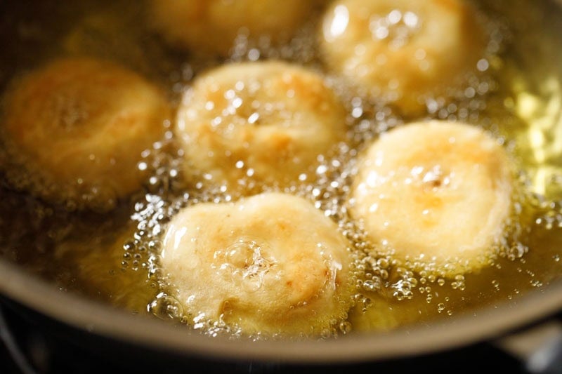 frying badusha becoming a deeper shade of golden.