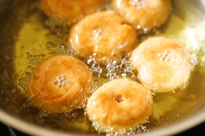 frying balushahi to golden brown.