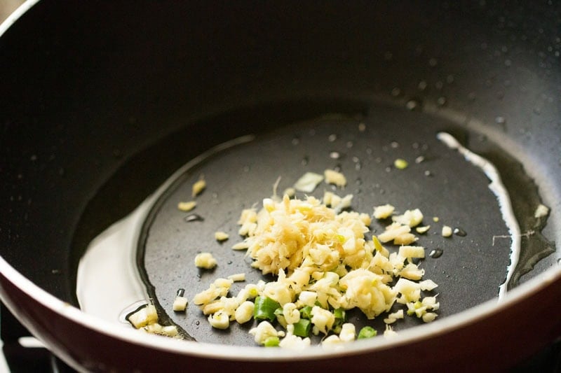 Chopped ginger, garlic and green chillies in frying pan.