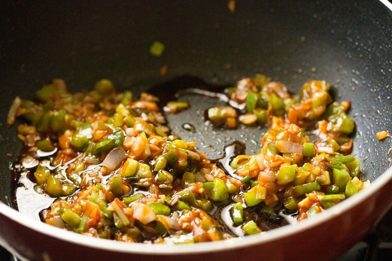Chopped vegetables with soy sauce in a pan.