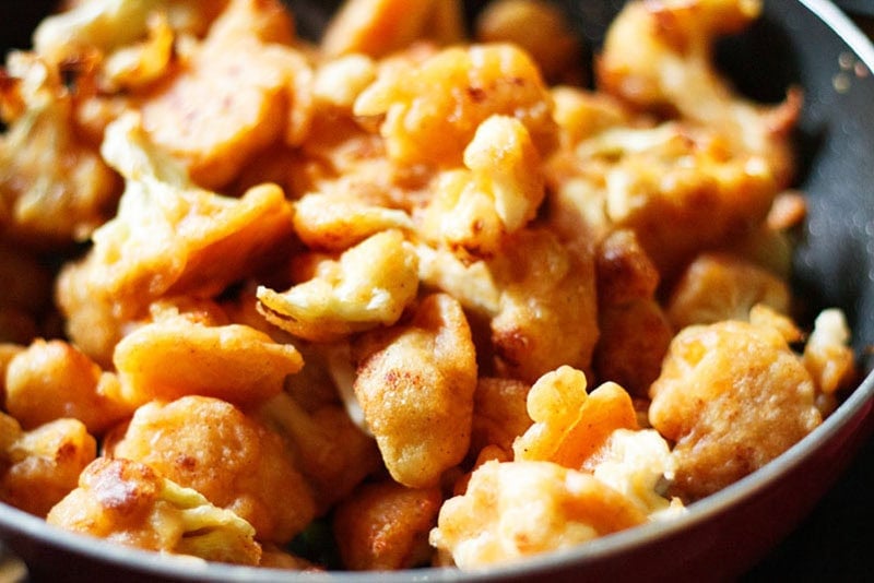 Fried cauliflower in a pan.