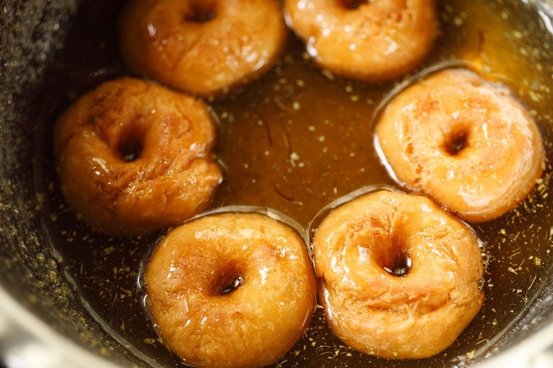 soaking badusha in sugar syrup.