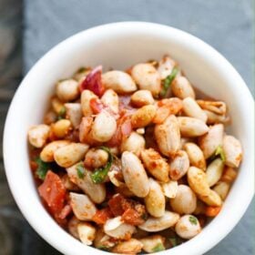 Bowl of spicy peanut chaat made with boiled peanuts.