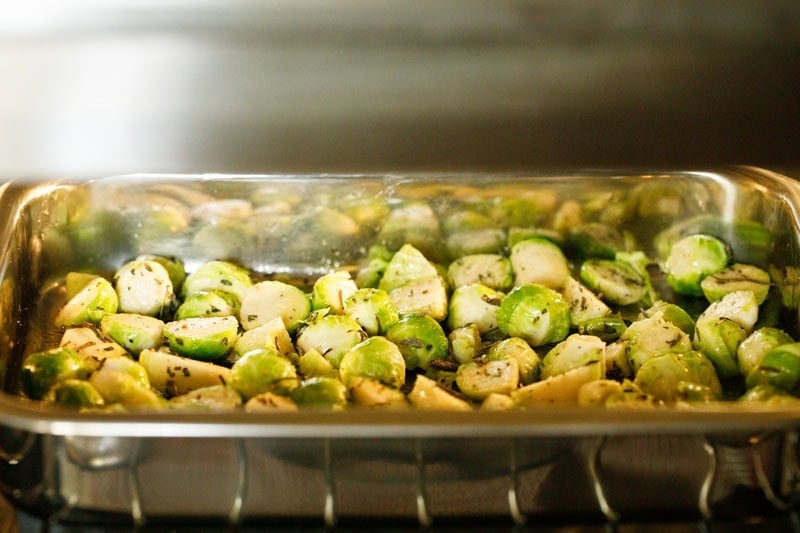 Brussels sprouts on baking tray in oven.