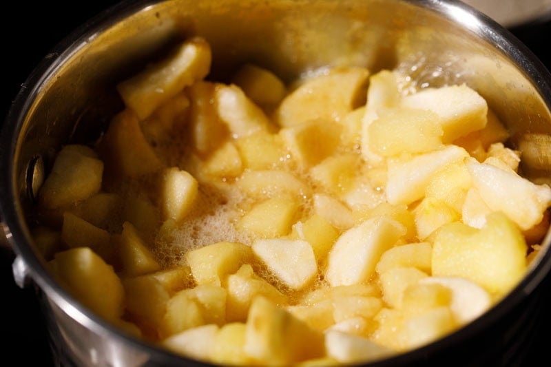 Apples cooking in pan.